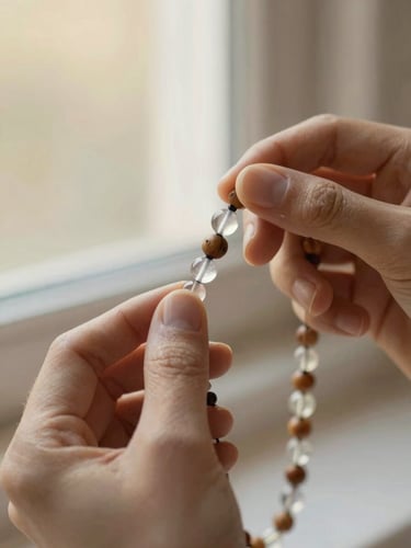 Close-up of hands threading premium crystal and wooden beads onto a delicate strand, warm natural window light, soft focus, 35mm