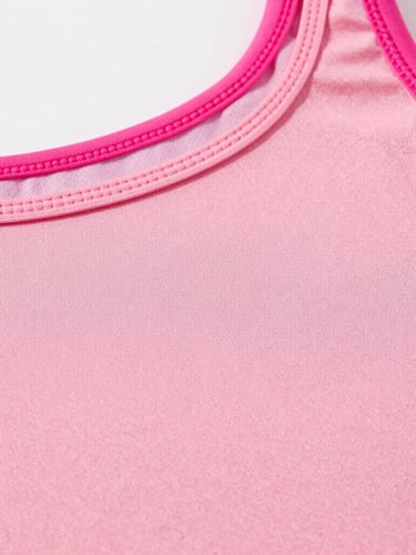 Close-up of high-quality pink activewear fabric texture, detailed stitching, clean bright studio lighting, professional textile presentation.