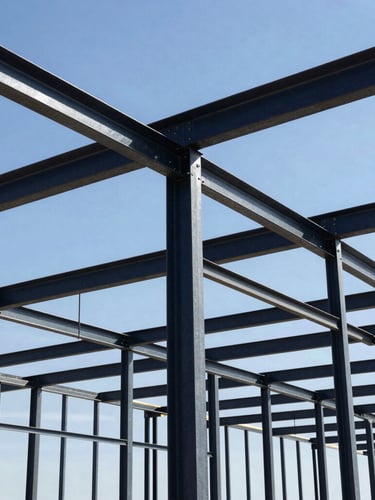 Low-angle architectural shot of a massive engineered metal barn frame under construction, heavy steel beams bolted together, harsh high-contrast Texas sunlight, deep depth of field
