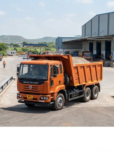 A powerful modern orange tipper truck parked at a clean industrial transport hub in Madhya Pradesh, bright natural daylight, sharp focus, 35mm lens
