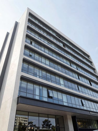 Wide-angle architectural photograph of a modern commercial building facade with clean lines and large windows, bright natural daylight, high-end real estate in Paraná