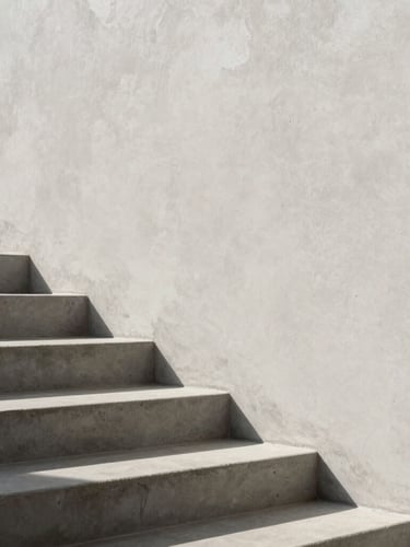 Architectural detail of concrete stairs meeting a smooth plaster wall, sharp shadows from afternoon sun, minimalist luxury aesthetic