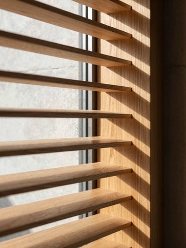 Close-up of warm timber slats filtering sharp directional afternoon sunlight, creating clean graphic shadow lines on a minimalist concrete wall, 35mm lens.