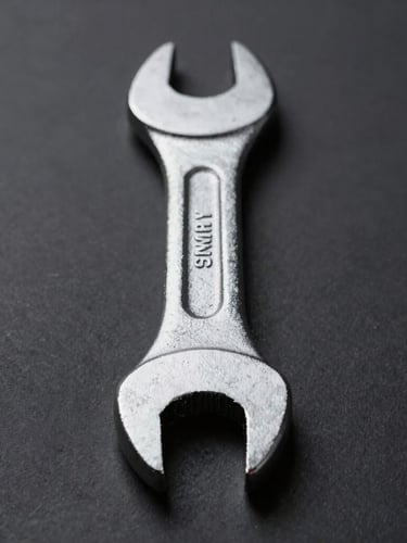 Straight-on structural profile of a heavy-duty forged steel wrench, pristine metallic texture, deep charcoal background, sharp directional studio lighting, 50mm macro shot