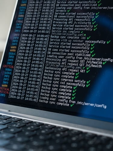 Macro shot of a laptop screen displaying clean server log lines and green checkmarks, sharp focus on terminal text, dark background with electric blue reflections