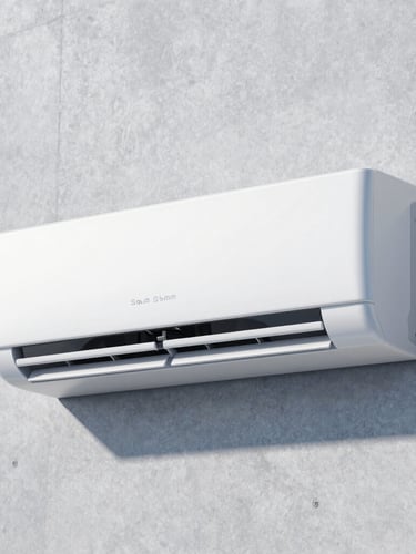 Crisp editorial photography of a sleek modern white air conditioning unit mounted on a minimalist concrete wall, bright natural daylight, cool blue ambient tones, sharp focus, 35mm