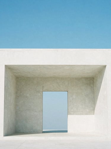 Symmetrical architectural shot of a minimalist white concrete pavilion against a clear blue sky, sharp shadows, 35mm lens