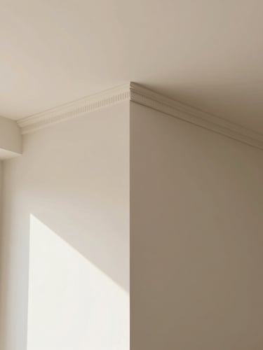 Close-up of a perfectly aligned molding joint where wall meets ceiling in a sunlit, minimalist interior, emphasizing precision and craftsmanship, warm neutral tones.