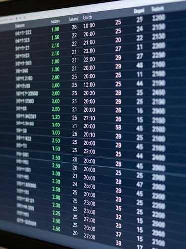 Macro shot of a high-density financial terminal interface showing automated ledger mapping, sharp focus, cool indirect office light, deep slate tones