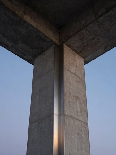 Symmetrical low-angle shot of a raw concrete and brushed steel column against a twilight sky, clean geometric lines, architectural focus