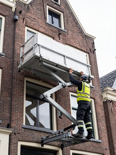 Low-angle shot of a professional Dutch furniture moving lift extended to a third-floor window of a brick building in Haarlem, certified operator in safety gear securing a large load, bright daylight