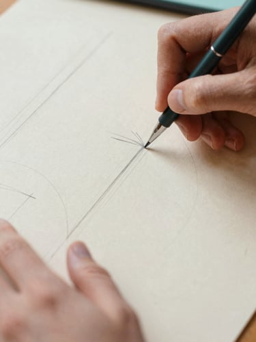 Close-up of hands sketching wireframes on warm textured paper, soft natural daylight, pastel tones, shallow depth of field, 35mm