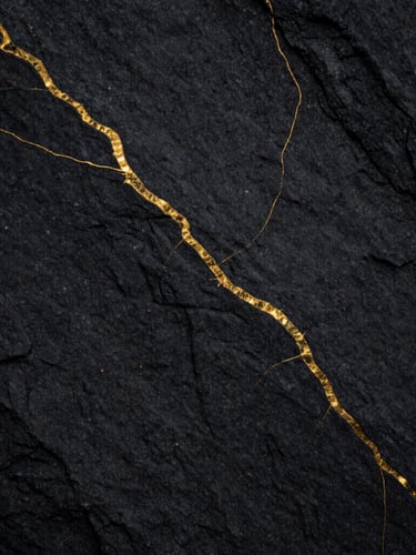 Macro shot of natural cleft sandstone surface, deep charcoal tones with rich gold veining pattern, sharp texture detail, low-key lighting