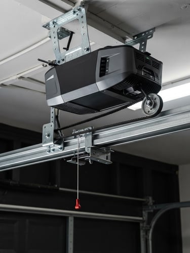 Clean close-up of a modern smart garage door opener unit, belt drive visible, mounted in a well-lit residential garage, crisp details, high-contrast, 35mm lens.
