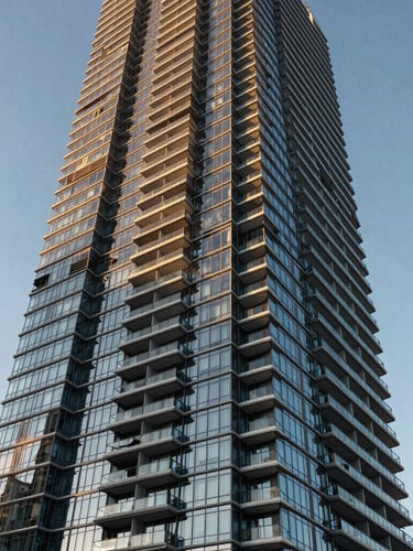 High-contrast architectural rendering of a modern glass residential skyscraper in Miami, sharp coastal sunlight reflecting off the facade, low-angle shot, 35mm