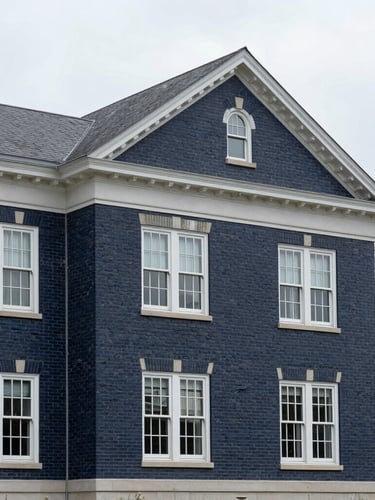 An architectural crop of a classic brick building in Westchester County under soft overcast daylight, clean lines, professional 35mm photography