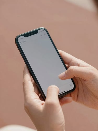 Close-up of elegant hands holding a smartphone in soft natural daylight, displaying a secure messaging screen, warm blush and terracotta background tones, 35mm photography