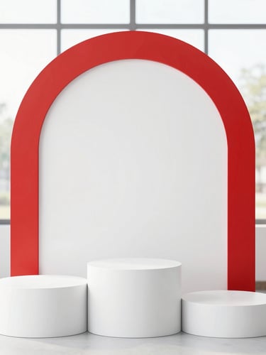 Straight-on eye-level shot of a modern white arch backdrop paired with three white cylindrical plinths of varying heights, bright natural indoor lighting, 35mm.