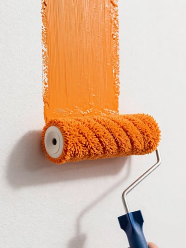 Tight macro shot of a paint roller leaving a saturated path of vivid orange paint on a clean white wall, bright natural daylight, clean sharp focus