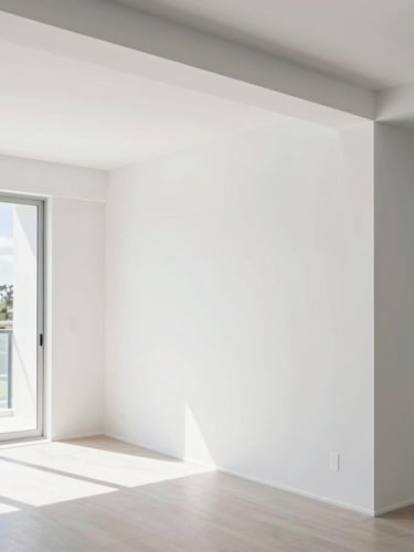 Bright architectural photography of a modern South Florida living room with freshly painted crisp white walls and razor-sharp trim lines, daylight pouring in, 35mm lens