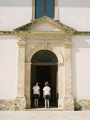 Warm daylight photo of the historic parish school entrance in Tolosa, soft shadows, welcoming architecture, 35mm photography