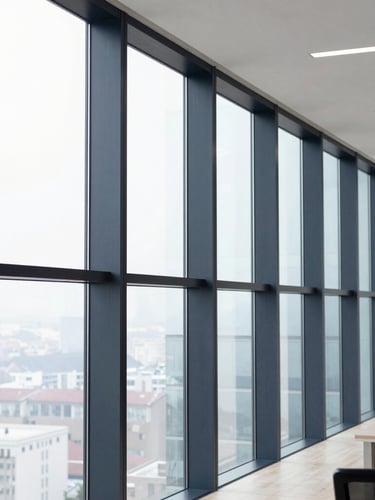 Crisp architectural photography of a modern structured office room, bright natural window light, sharp focus, 35mm