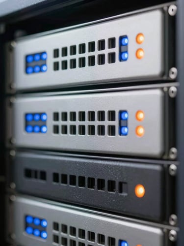 Extreme close-up macro shot of a clean, high-precision server rack with blue and orange status indicator lights, clinical daylight-balanced lighting, sharp shadows.
