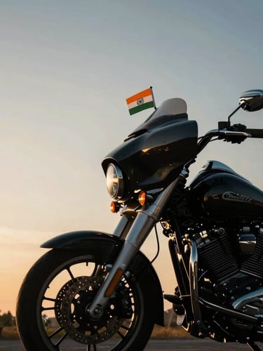 Low-angle heroic shot of a premium cruiser motorcycle with a small Indian flag securely mounted on the handlebar, gleaming in the golden hour sunrise light.