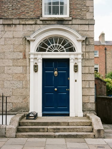 Crisp architectural detail of a Georgian doorway in Dublin, freshly painted in deep blue, bright natural daylight, 35mm
