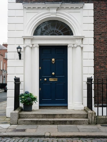 Crisp architectural portrait of a bright Dublin Georgian entrance, deep blue painted door, immaculate white plasterwork, natural Irish daylight, 35mm.