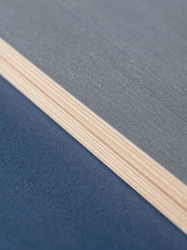 Macro close-up of a perfectly sanded wooden trim, clean lines, professional dust-free sanding setup, bright natural daylight