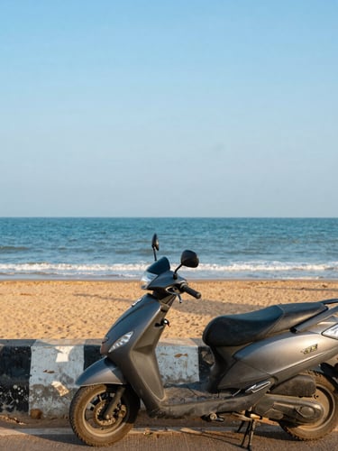 A clean Suzuki Access 125 scooter parked near a coastal highway overlook in Puri, with the blue bay of Bengal visible under a bright, high-contrast daylight sky, sharp focus.