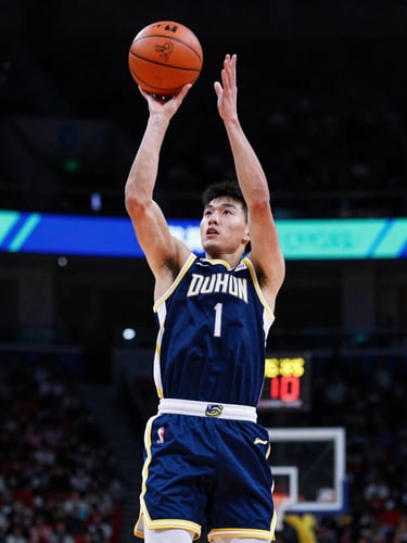 Action freeze-frame of a young player shooting a layup, high-contrast stadium lighting, sharp shadows, athletic intensity.