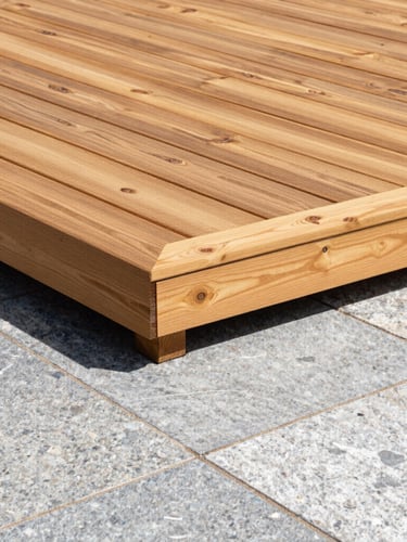 Sharp architectural detail shot of a custom-milled cedar deck seamlessly joining a hand-laid granite stone patio, bright natural daylight, crisp focus.
