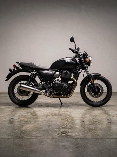 Wide low-angle shot of a premium motorcycle parked on polished concrete showroom floor under controlled studio strobe light, hard shadows defining the silhouette, matte black body with chrome details, no rider, neutral backdrop