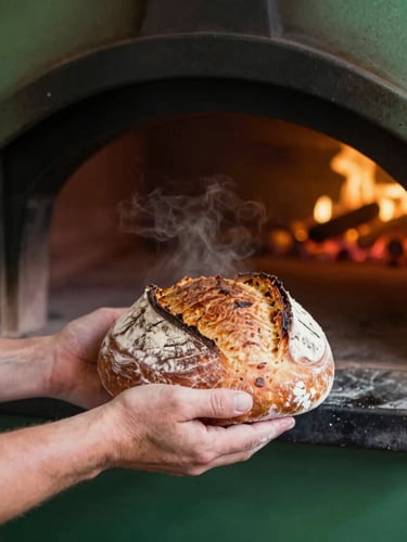 A close-up portrait of a baker's flour-dusted hands pulling a fresh, steaming sourdough loaf from a dark wood-fired oven, warm golden embers glowing in the background, soft natural side-light