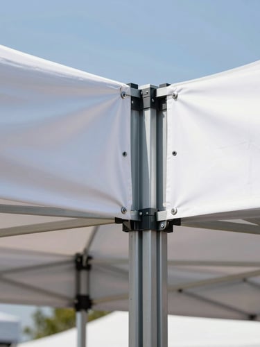 Close-up of a heavy-duty steel gazebo frame connector joint, robust industrial build, with a clean taut printed banner attached with metal grommets, bright daylight.