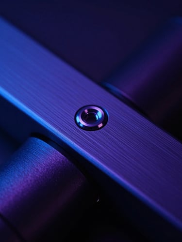 Sleek close-up of dark brushed metal hardware with high-contrast electric blue ambient light, macro lens, shallow depth of field, sharp clean lines