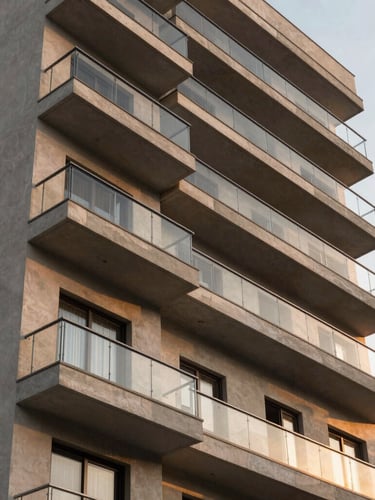 Modern apartment building facade in Suzano, clean architectural lines, warm sunset light reflecting on glass balconies, professional framing.