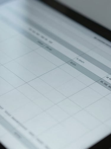 An extreme close-up of a financial balance sheet on a tablet screen, cool diffused office daylight, sharp corporate grid lines, 35mm