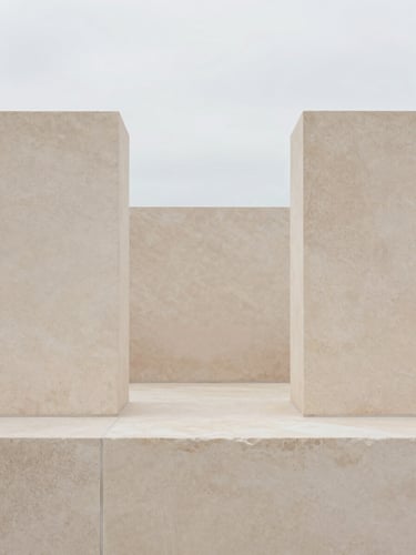 Minimalist geometric composition of balanced sandstone blocks under soft diffused overcast daylight, muted earth tones, 35mm