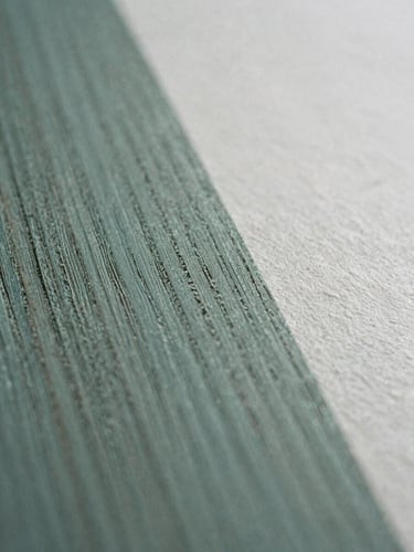 Macro detail of hand-carved wood grain and textured paper in soft morning light, 35mm film style