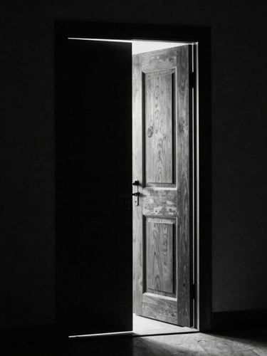 Cinematic high-contrast black and white photograph of a solitary heavy wooden door slightly ajar, a single shaft of light piercing the deep shadows, 35mm grain