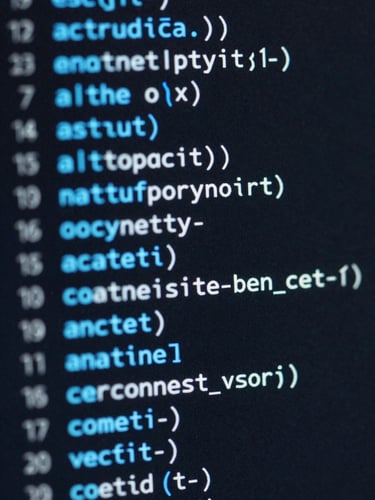 Macro close-up of clean, structured code on a dark screen, glowing electric-blue syntax highlighting, sharp focus