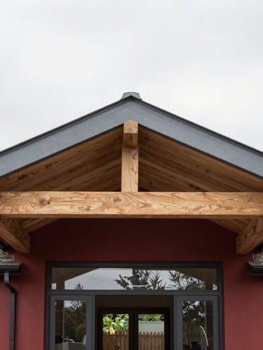 Straight-on architectural photograph of a bright, modern UK home extension, showing clean structural steel beams paired with bespoke oak joists, natural overcast daylight, rich desaturated tones