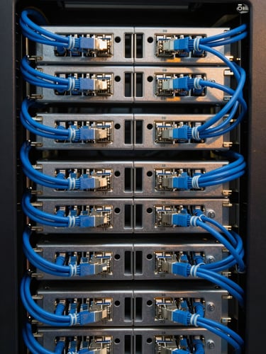 Symmetrical straight-on macro shot of a perfectly organized server rack, clean blue ethernet cables neatly routed and bundled with velcro, crisp technical studio lighting, 35mm