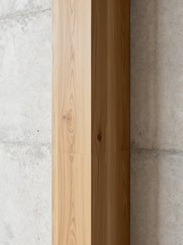 Architectural detail of a seamless corner where warm rift-sawn oak meets a polished concrete wall, bright indirect natural light, minimalist luxury, portrait aspect