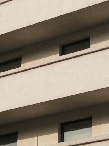 Detail of structured architectural facade with clean lines and shadow play, soft diffused daylight, minimal composition