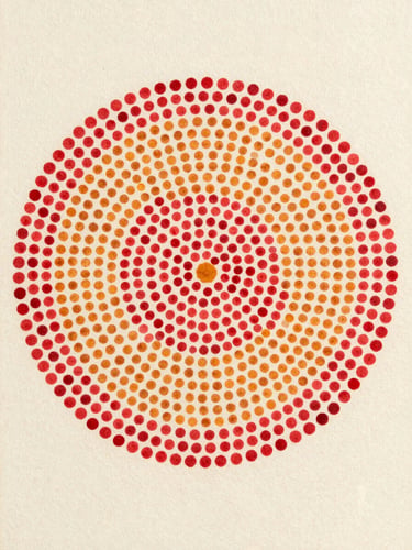 Close flatlay of a small pointillist panel, tightly packed crimson and ochre dots forming a dense circular cluster on ivory ground, diffuse north-facing studio light, edges of canvas visible