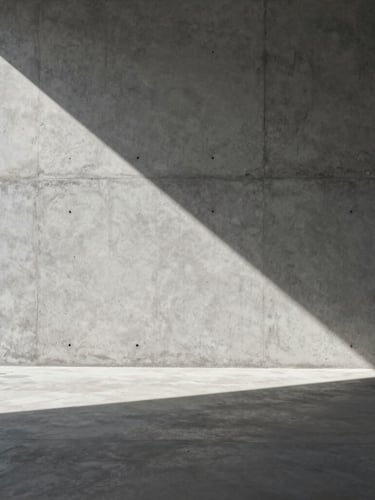 Architectural interior study, portrait orientation. Hard direct sunlight casting a sharp geometric shadow across a smooth raw concrete wall and cast-concrete floor, minimalist empty volume.